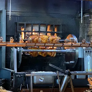 The rotisserie chicken cooking