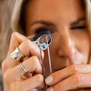 Sierra Moon owner, Shawn, louping a blue topaz for a custom design.