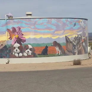 Beautiful mural on water tank next to shelter