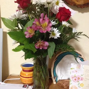 Flowers they received. Way too much greenery they definitely didn't want to use more flowers.