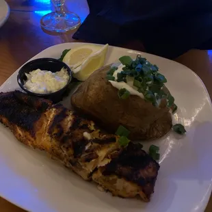 grilled fish and a baked potato