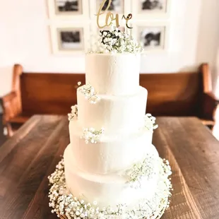 Simple buttercream wedding cake with baby's breath