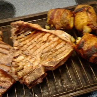 Porterhouse and NY Strip withe cheddar bacon potato bombs. Steaks bought at Acropolis, enjoyed by my family.