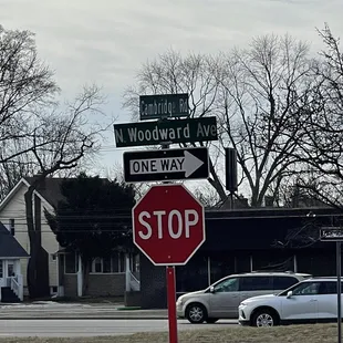 a stop sign and a one way sign