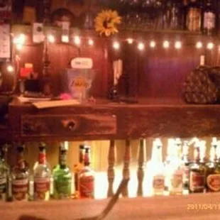 a bar with many bottles of alcohol
