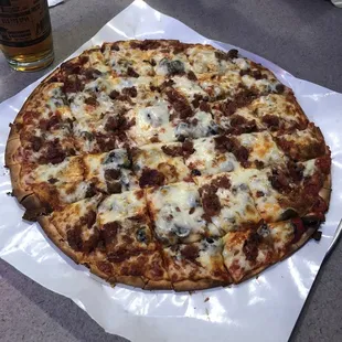 Bacon, mushroom and black olive pizza