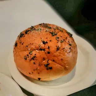 Warm bread roll with herbs
