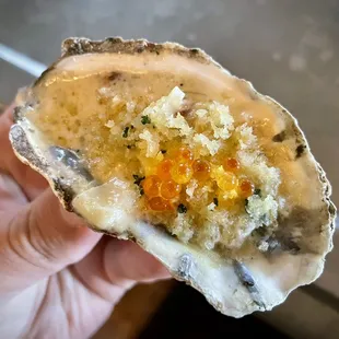 Grilled oyster with creamed leeks, bacon, and trout roe. Available at the bar on weekdays during &quot;Signature Hour.&quot;