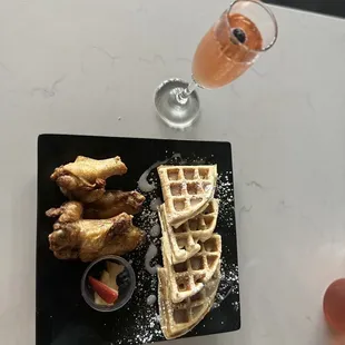 Waffles and chicken and cranberry mimosa