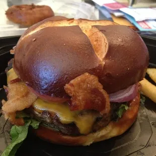 a burger and french fries on a tray