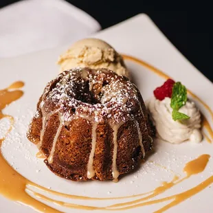 Apple Spice Cake served with eggnog ice cream and Dulce de Leche sauce