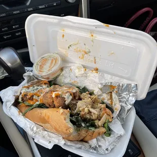 a sandwich in a styrofoam container