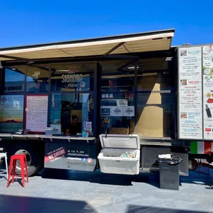 a food truck with menus on the side