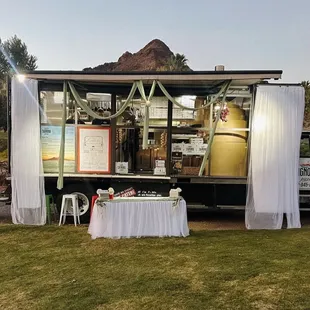 a food truck parked in a field