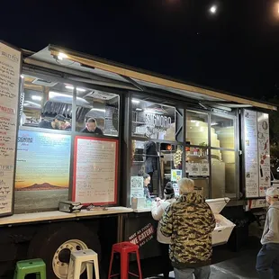 people ordering food from a food truck