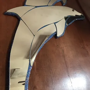 a dolphin shaped mirror