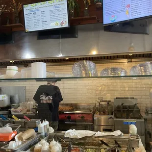 Food making station and menu on screen