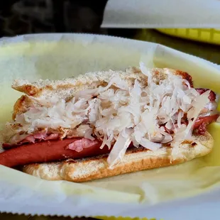 Reuben Hot Dog with sauerkraut and spicy mustard. Both the bun and dog are split and grilled. Mmmmm, $5