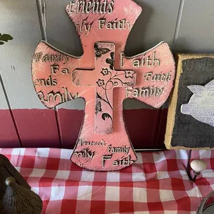 a pink cross on a table