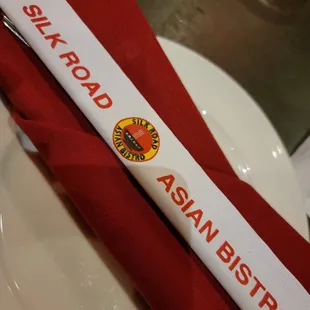 a red napkin with a white ribbon