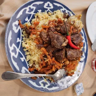 a plate of meat and rice