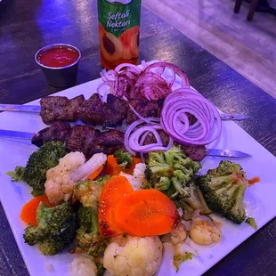 Lamb Ribs Kebab with Steamed Vegetables and peach juice