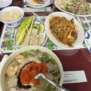 Combination pho, beef pad Thai, beef larb and Lao style papaya.