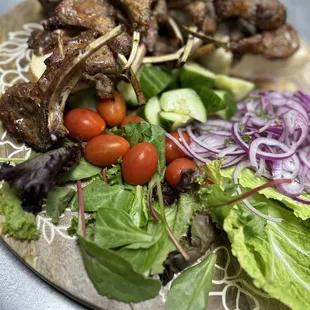 Family sized mixed kebabs but with the Lamb Chops, tender lamb ribs very well seasoned, with a side of tomatoes, onions, and cucumbers