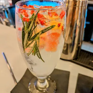 Gin, grapefruit  rosemary, tonic and pink peppercorns