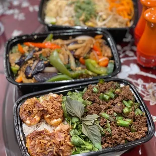 three trays of food on a table