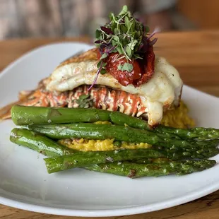 a plate of seafood and asparagus