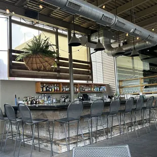 This is the outdoor bar.Ehen people are in those seats, I t's buzzing, but still quiet, sophisticated, and enjoyable.