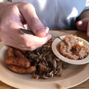 BBQ plate with hushpuppies and red slaw. The red slaw was the best of its kind I've had.