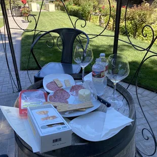 Wine tasting outside in their beautiful garden.