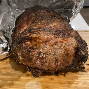 a roast of meat wrapped in foil