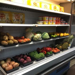 a display of vegetables and fruits
