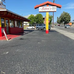 a shadow of a person on the pavement