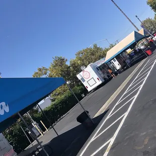 The parking lot where a few trucks are open for business