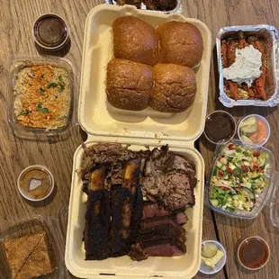 Pitmaster platter for $75: 4 meat picks, 4 sides (deviled eggs, Cabbage Slaw, harissa carrots, and babaganoush), and 2 dessert