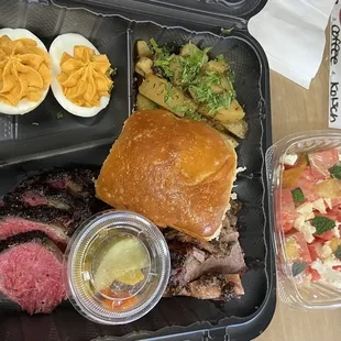 2x2 platter: prime brisket, short rib pastrami, lemon schmaltz potatoes, smoked deviled eggs; watermelon salad.