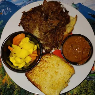 Very good pulled lamb sandwich on Challah. Some pickled veggies. And a uniquely tasty mustard sauce.