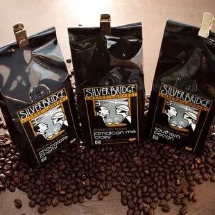 three packages of coffee beans