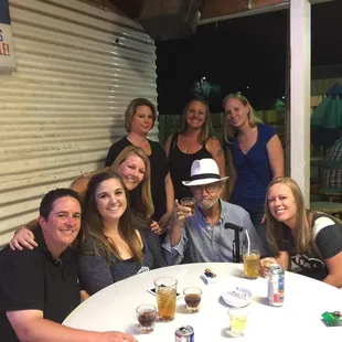 a group of people sitting around a table