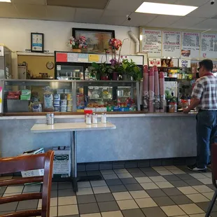 a man standing at the counter