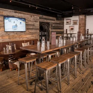 a long wooden table and chairs