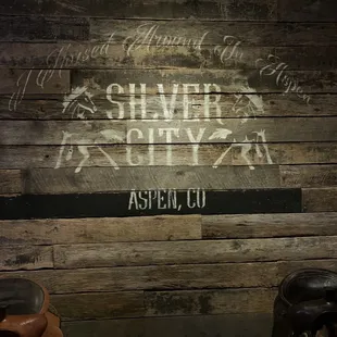 a sign on a wooden wall