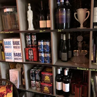 a shelf full of wine bottles