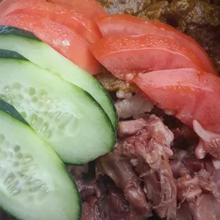 Silver Krust&apos;s pigtail (salted pork), goat, spinach rice
