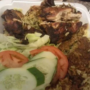 Jerk chicken, rice pilaf and salad.