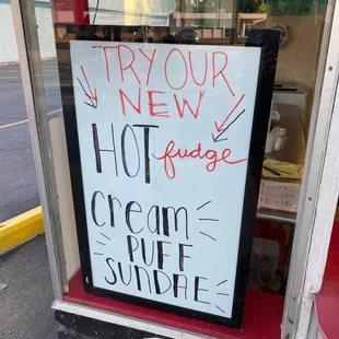 a sign in the window of a store